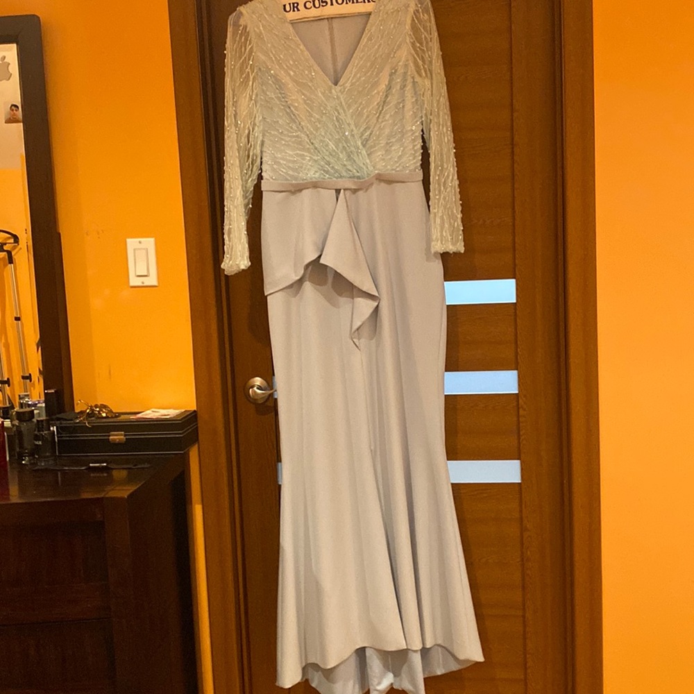 Light blue evening dress with pearls and sequins.